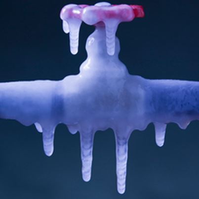 Image of a frozen spigot and pipe