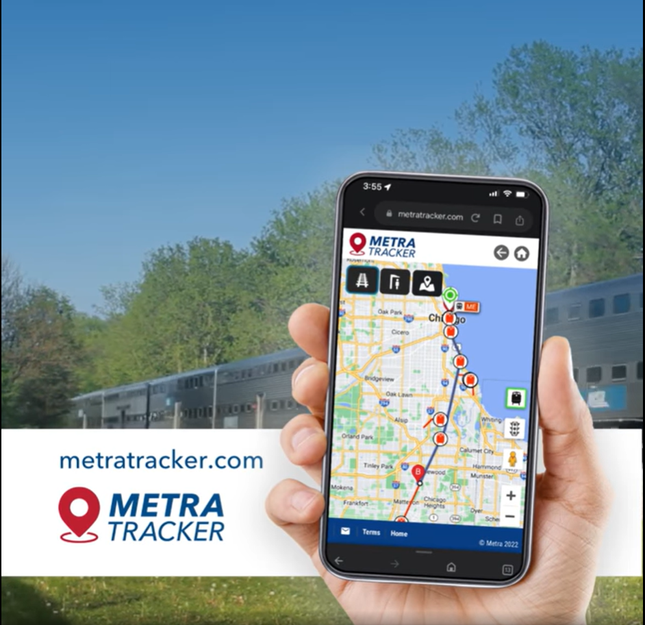 A person holding their cell phone showing a Metra train map and the location of their train.