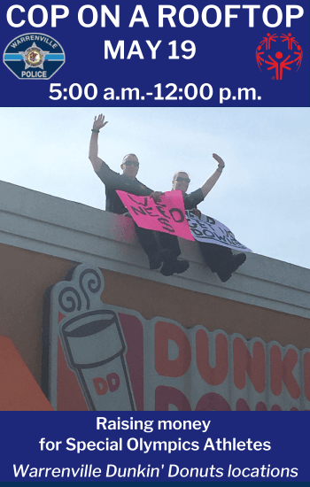 Police sit on the Dunkin Donuts roof to get donations for Special Olympics.