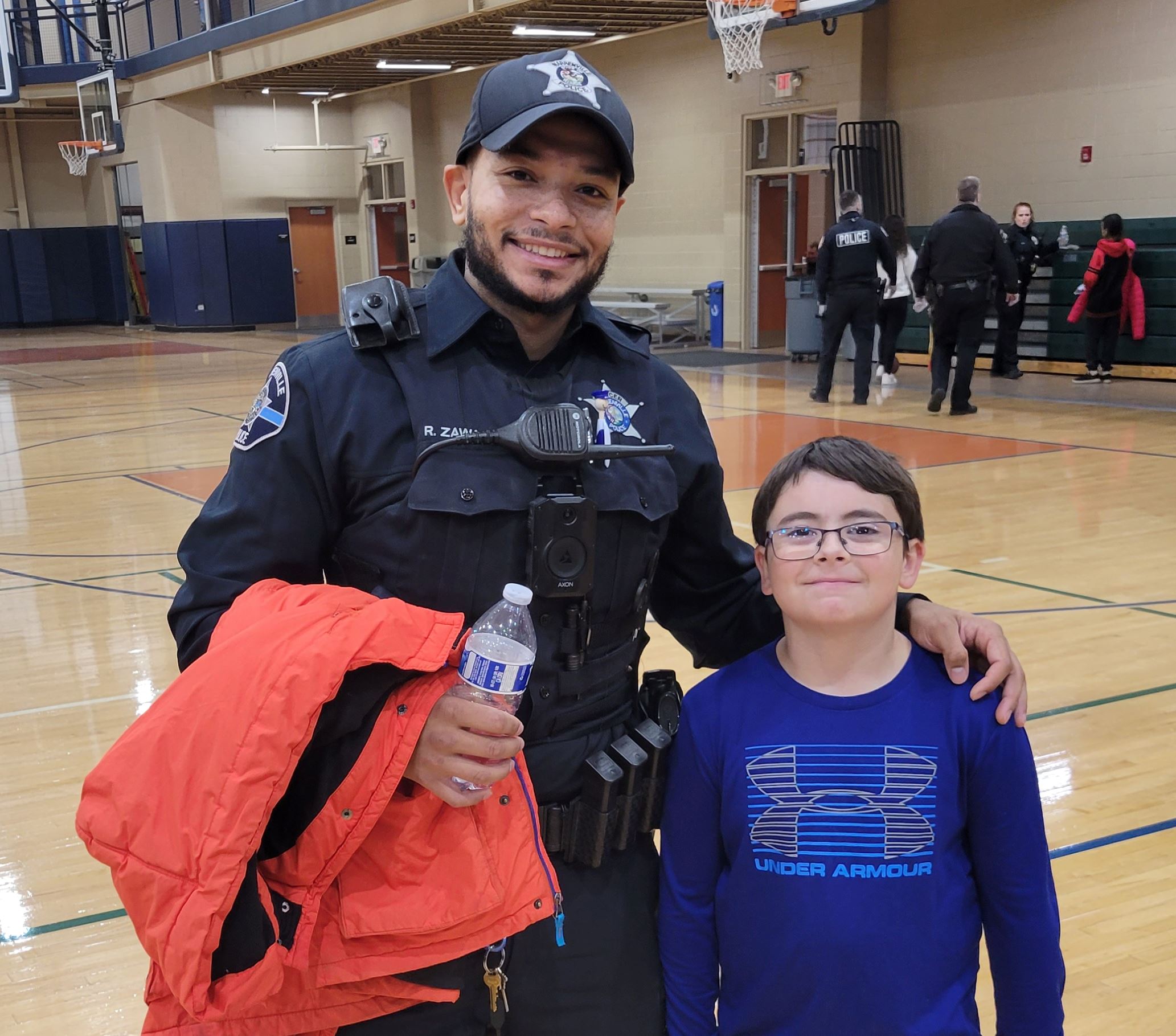 Officer Zawacki and child at Shop with a Cop 2022